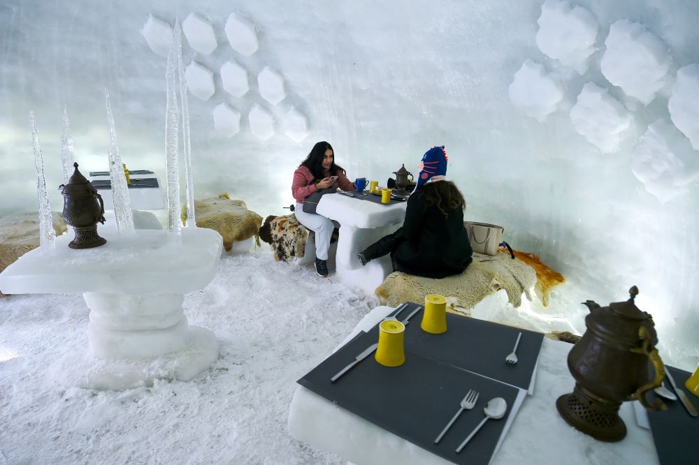 Gulmarg: Guests have tea and breakfast inside an Igloo, made by Kolahoi Green Hotel and Resorts, in Gulmarg, Saturday, Feb. 6, 2021. (PTI Photo/S. Irfan)